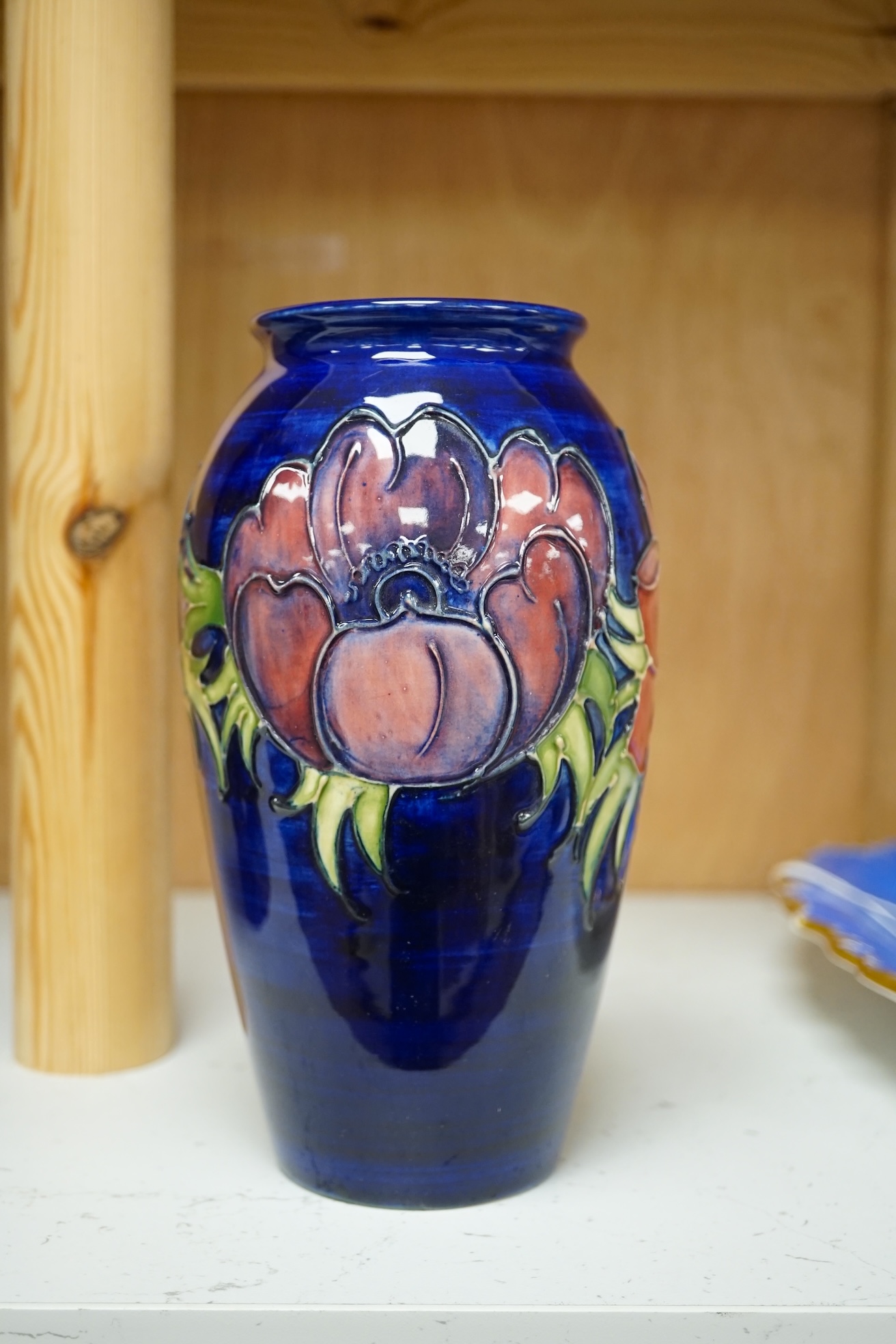 A Moorcroft anemone pattern vase, 18.5cm tall. Condition - good